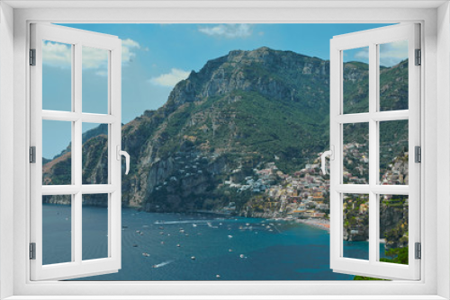 Fototapeta Naklejka Na Ścianę Okno 3D - One of the best resorts of Italy with old colorful villas on the steep slope, nice beach, numerous yachts and boats in harbor and medieval towers along the coast, Positano.