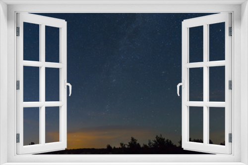 Fototapeta Naklejka Na Ścianę Okno 3D - night outdoor scene, starry sky above prairie and forest silhouette
