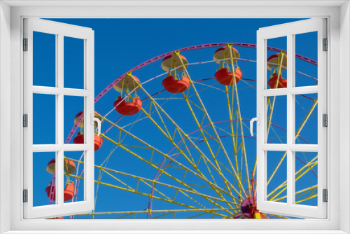 Fototapeta Naklejka Na Ścianę Okno 3D - Ferris wheel on a background of blue autumn sky.