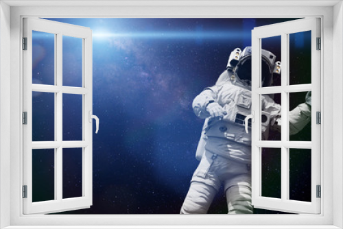 Fototapeta Naklejka Na Ścianę Okno 3D - spacewalking astronaut lit by the Sun