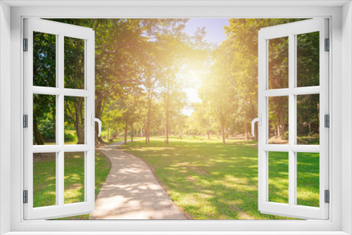 Fototapeta Naklejka Na Ścianę Okno 3D - New pathway and beautiful trees track for running or walking and cycling relax in the park on green grass field on the side of the golf course. Sunlight and flare background concept.