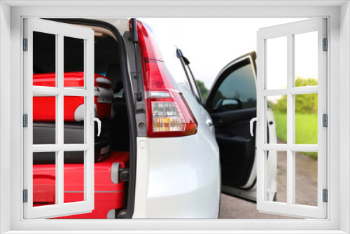 Fototapeta Naklejka Na Ścianę Okno 3D - Closeup of rear or back side of white car carrying luggage, suitcases with natural background. Preparation for lovely family holiday. 