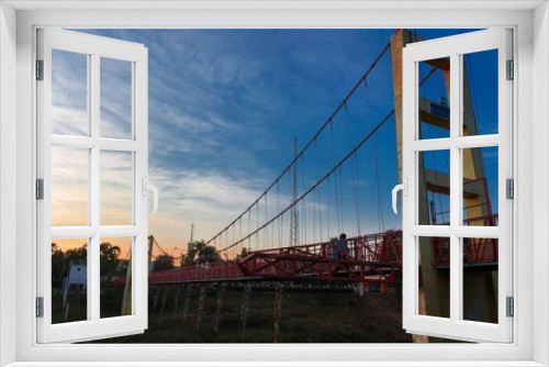 Fototapeta Naklejka Na Ścianę Okno 3D - The bridge over the river when the sunset