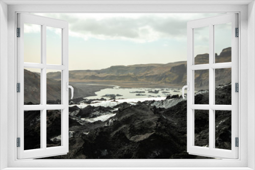 Fototapeta Naklejka Na Ścianę Okno 3D - View from the ash covered Solheimajokull glacier toward the fjord
