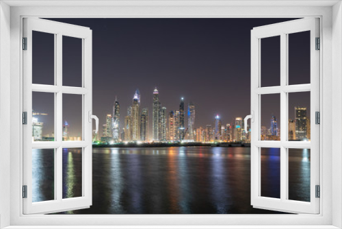 Fototapeta Naklejka Na Ścianę Okno 3D - Dubai city skyline at night showing JBR 