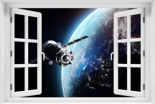 Fototapeta Naklejka Na Ścianę Okno 3D - Cargo spaceship on orbit of the Earth planet. Dark space. Elements of this image furnished by NASA