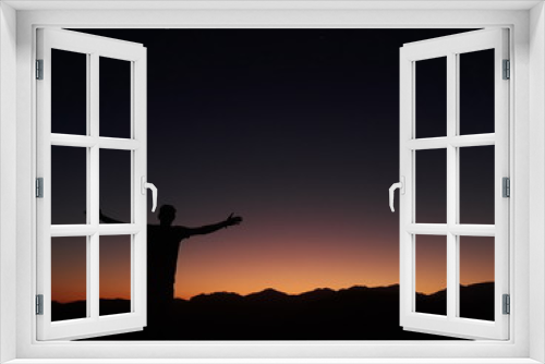 Fototapeta Naklejka Na Ścianę Okno 3D - standing with arms wide open at sunset