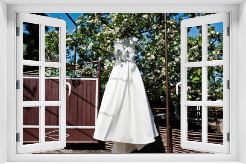 Fototapeta Naklejka Na Ścianę Okno 3D - Elegant white wedding dress at bride morning.
