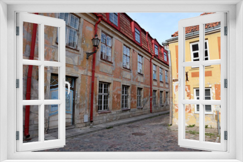 Fototapeta Naklejka Na Ścianę Okno 3D - Old city streets traditional baltic tourism architecture house facades in historical part of town with stone road and colorful original buildings