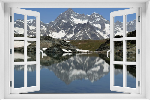 Fototapeta Naklejka Na Ścianę Okno 3D - Mountains reflected in mirror like surface of a lake near Riffelsee, Switzerland