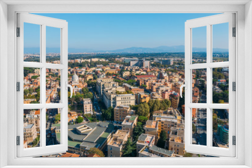 Aerial view of Rome Italy residential areas with houses, flight on drone above city buildings in sunny day.