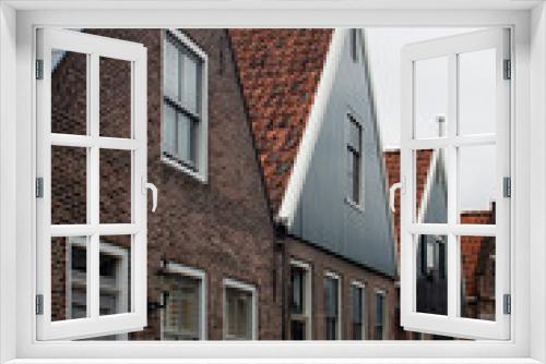 Fototapeta Naklejka Na Ścianę Okno 3D - View of historical, traditional and typical houses in Edam. It is a town famous for its semi hard cheese in the northwest Netherlands, in the province of North Holland.