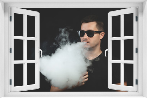 Fototapeta Naklejka Na Ścianę Okno 3D - Vaping man with vaporizer and a cloud of vapor