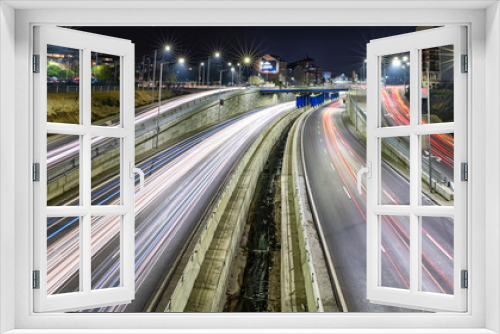 Fototapeta Naklejka Na Ścianę Okno 3D - Beautiful night traffic junction road with lights of vehicle movement aerial view from drone