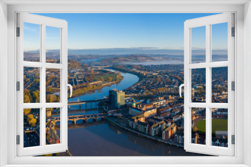 Fototapeta Naklejka Na Ścianę Okno 3D - An aerial view at sunrise of Newport city centre, south wales United Kingdom, taken from the River Usk