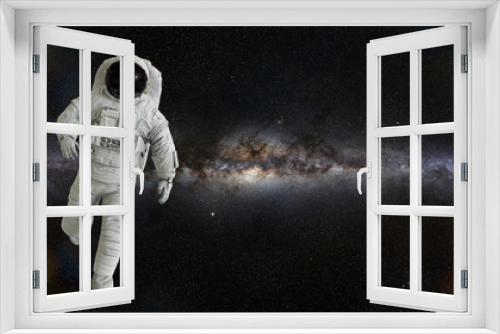 Fototapeta Naklejka Na Ścianę Okno 3D - spacewalking astronaut lit by the Sun