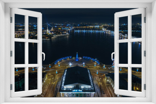 Fototapeta Naklejka Na Ścianę Okno 3D - View of the Strelka Vasilievsky Island with Christmas decorations from the air. St. Petersburg center with a Christmas tree view from a height above the building of the exchange.