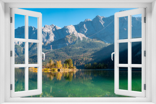 Fototapeta Naklejka Na Ścianę Okno 3D - Panorama Image of Eibsee during autumn with the Zudspitze in the background and water reflections
