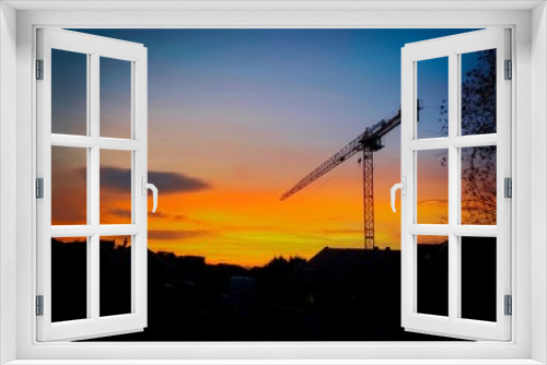 Fototapeta Naklejka Na Ścianę Okno 3D - construction crane at sunset