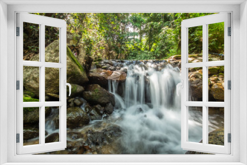 Fototapeta Naklejka Na Ścianę Okno 3D - Kathu Waterfall in the tropical forest area In Asia, suitable for walks, nature walks and hiking, adventure photography Of the national park Phuket Thailand,Suitable for travel and leisure.
