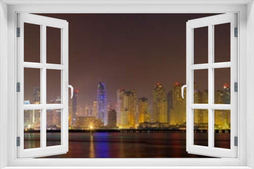 Fototapeta Naklejka Na Ścianę Okno 3D - Dubai - The evening panorama of Marina towers from Palm Island.