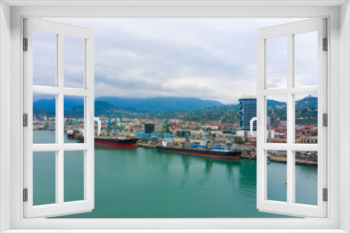 Fototapeta Naklejka Na Ścianę Okno 3D - Bulk cargo ship under port crane, Batumi seaport, Georgia