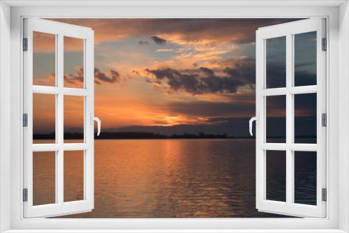Fototapeta Naklejka Na Ścianę Okno 3D - sunset over a lake
