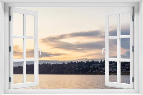 Fototapeta Naklejka Na Ścianę Okno 3D - White Rock, British Columbia, Canada. Beautiful Panoramic View of Residential Homes on the Ocean Shore during a sunny and cloudy summer sunset.
