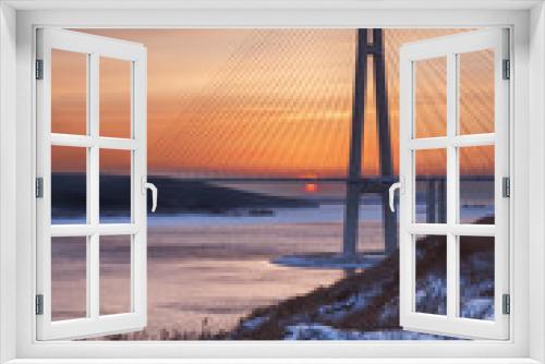 Fototapeta Naklejka Na Ścianę Okno 3D - Winter sunset view with fresh snow and long cable-stayed bridge in Vladivostok, Russia