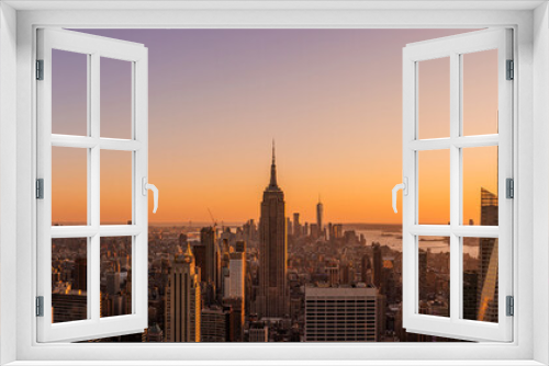 Fototapeta Naklejka Na Ścianę Okno 3D - Amazing panorama view of New York city skyscraper during sunset. Stunning view in Manhattan