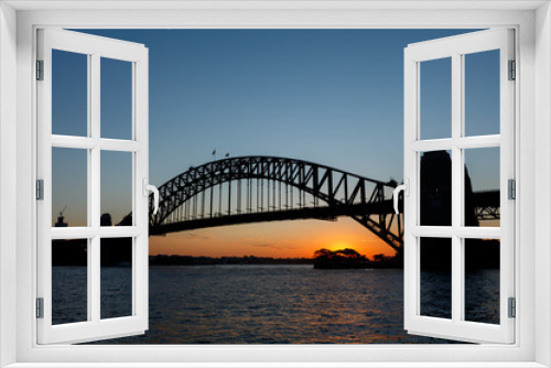 Fototapeta Naklejka Na Ścianę Okno 3D - Silhouette of Sydney Harbour Bridge viewed from Kirribilli at sunset