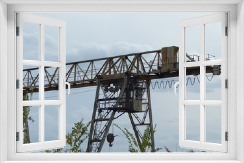 Fototapeta Naklejka Na Ścianę Okno 3D - Overhead crane. Cabin and winch - elements of an overhead crane. Photo