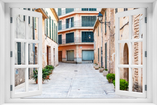 Fototapeta Naklejka Na Ścianę Okno 3D - Beautiful narrow historic streets of Alcudia Old Town in Majorca Mallorca