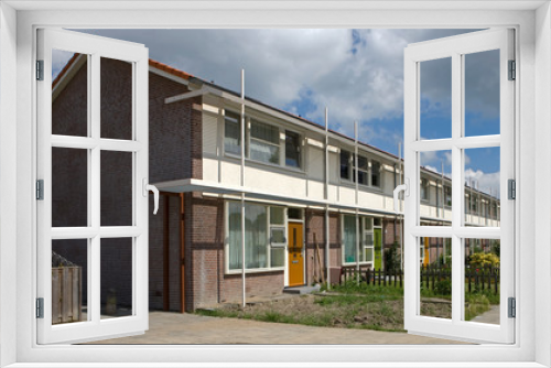 Fototapeta Naklejka Na Ścianę Okno 3D - Biddinghuizen. Modern Dutch architecture. Houses. Residential housing. Netherlands. Flevopolder
