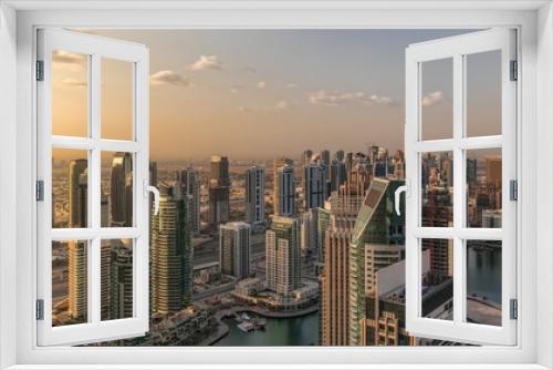 Fototapeta Naklejka Na Ścianę Okno 3D - Dubai Marina skyscrapers and jumeirah lake towers sunrise view from the top aerial timelapse in the United Arab Emirates.