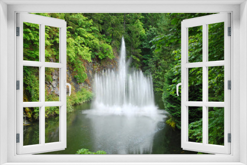 Fototapeta Naklejka Na Ścianę Okno 3D - Waterfountain in lush green park