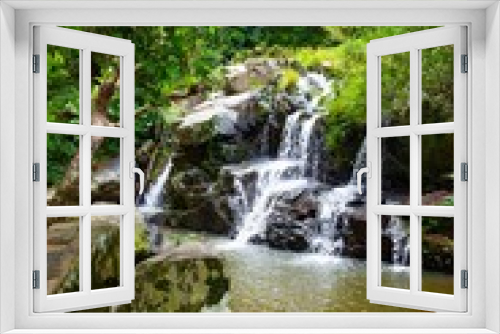 Fototapeta Naklejka Na Ścianę Okno 3D - Nature Tropical Waterfall Lanscape with foliage and stones