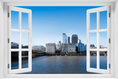 Fototapeta Naklejka Na Ścianę Okno 3D - City of London, United Kingdom 6th July 2019: London skyline seen from south bank, river Thames in foreground on summer day