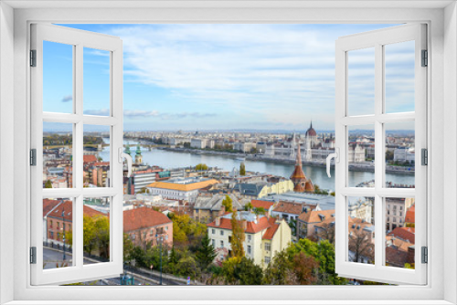 Fototapeta Naklejka Na Ścianę Okno 3D - Beautiful cityscape of Budapest, Hungary. Hungarian Parliament Building, Orszaghaz, in the background on the other side of the Danube river. Eastern European cities, the Hungarian capital