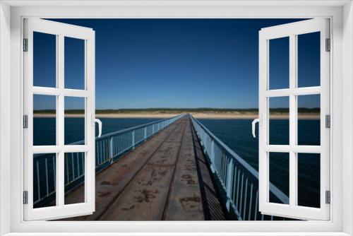 Fototapeta Naklejka Na Ścianę Okno 3D - lange Brücke zum Strand