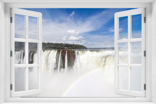 Fototapeta Naklejka Na Ścianę Okno 3D - View of Devil`s Throat With Rainbow Against Blue Sky and At Iguazu Falls, Argentina