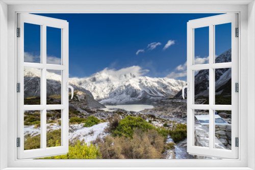 Fototapeta Naklejka Na Ścianę Okno 3D - Amazing view at Mount Cook New Zealand.Close up shot on the grass covered by snow.