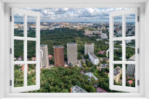 Fototapeta Naklejka Na Ścianę Okno 3D - Big city, aerial view. The microdistrict of a big city, residential buildings with many high-rise buildings.