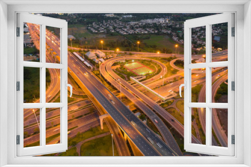 Fototapeta Naklejka Na Ścianę Okno 3D - Aerial view of highway junctions Top view of Urban city, Bangkok at night, Thailand. Light trails across road junction, traffic abstract and transportation concept..