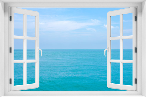Fototapeta Naklejka Na Ścianę Okno 3D - Clean blue sea water or ocean and clear blue sky and white clouds.