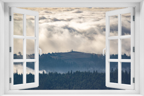 Fototapeta Naklejka Na Ścianę Okno 3D - The view from the heights of the mountains and forests covered by fog