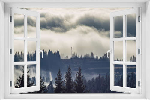 Fototapeta Naklejka Na Ścianę Okno 3D - The view from the heights of the mountains and forests covered by fog