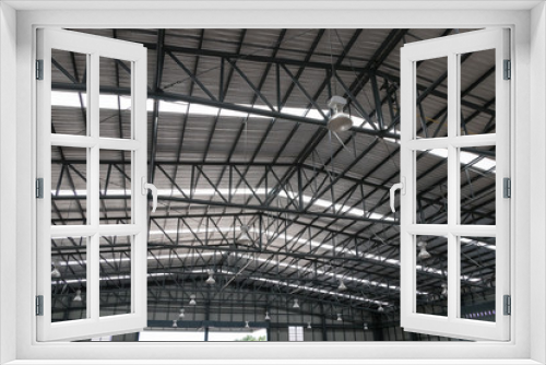 Fototapeta Naklejka Na Ścianę Okno 3D - Warehouse metal roofing, Large steel roof structure, bottom view with skylight translucent roof.