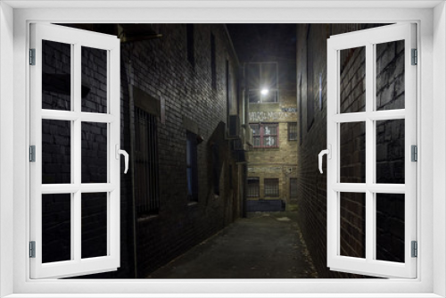 Fototapeta Naklejka Na Ścianę Okno 3D - Empty old alley ay night