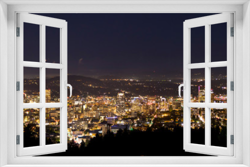 Fototapeta Naklejka Na Ścianę Okno 3D - Portland Oregon city skyline at night and powerful lights illuminating highrise office buildings. City that never sleeps.